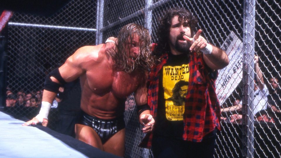 Cactus Jack battles Triple H within Hell In A Cell