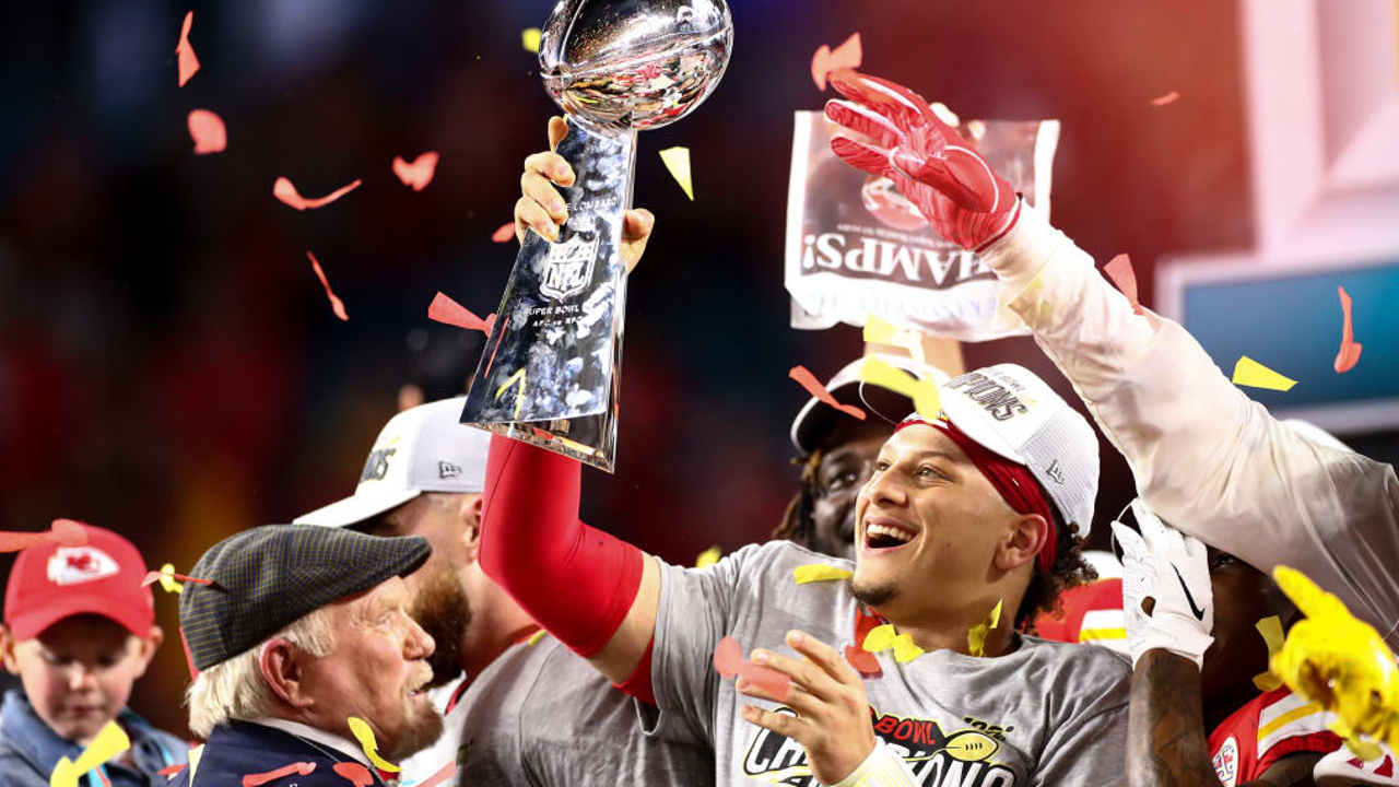 Patrick Mahomes Celebrates Super Bowl Victory with Trophy, WWE Belt