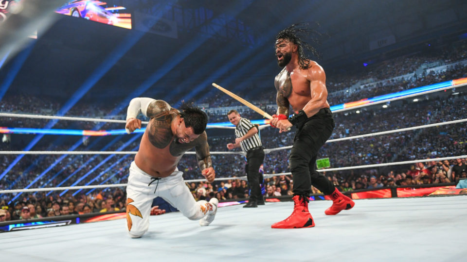 Roman Reigns hitting Jey Uso with a Kendo Stick at SummerSlam 2023