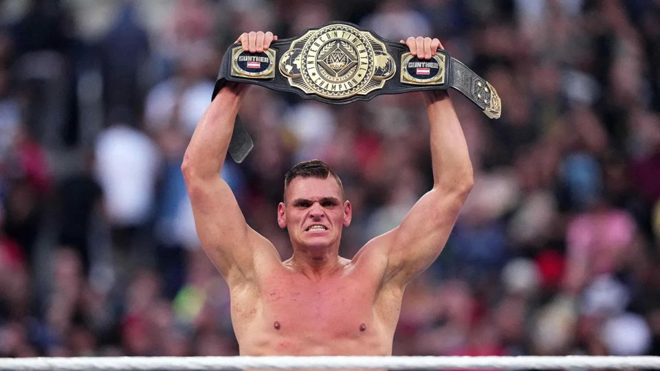 Gunther holding the Intercontinental Title above his head at WrestleMania 39